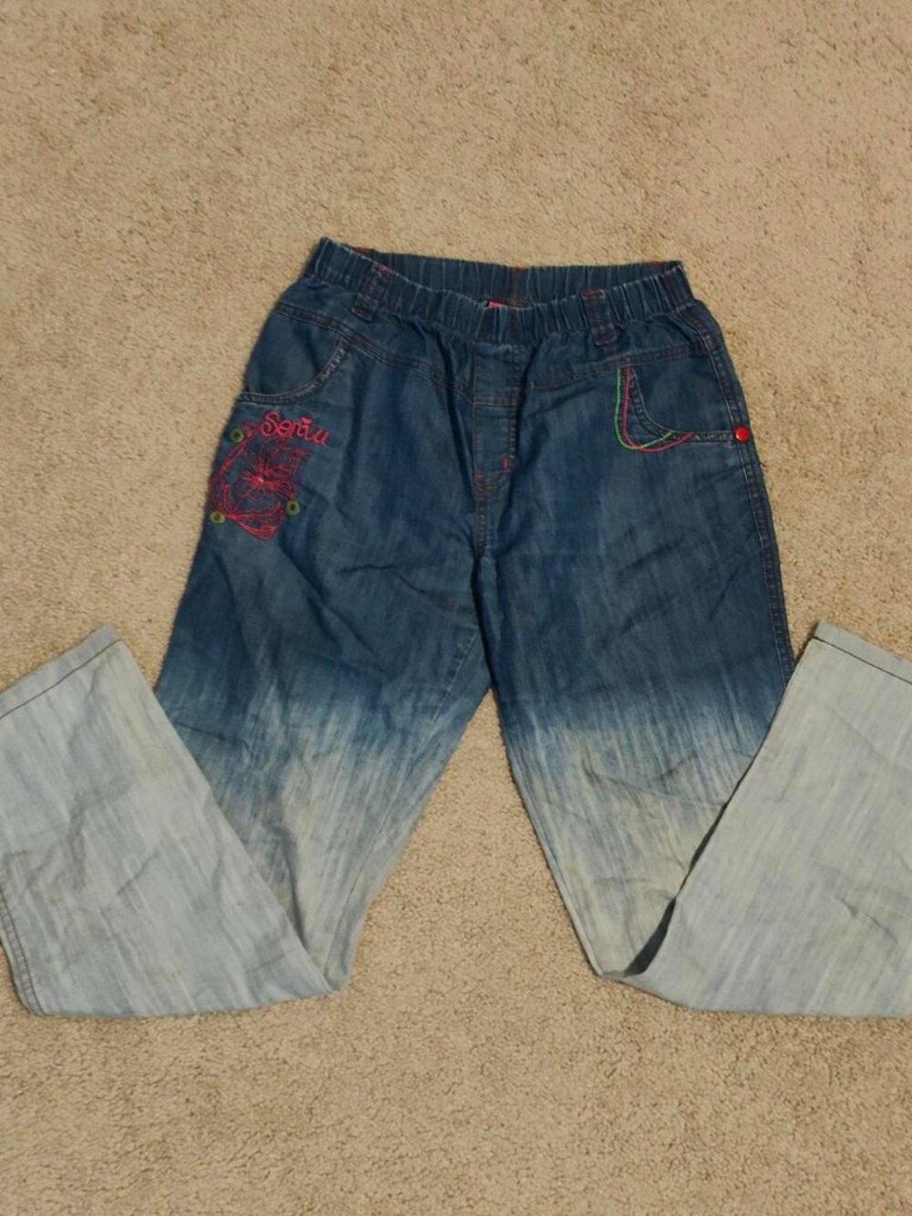 Whimsical Embroidered faded jeans